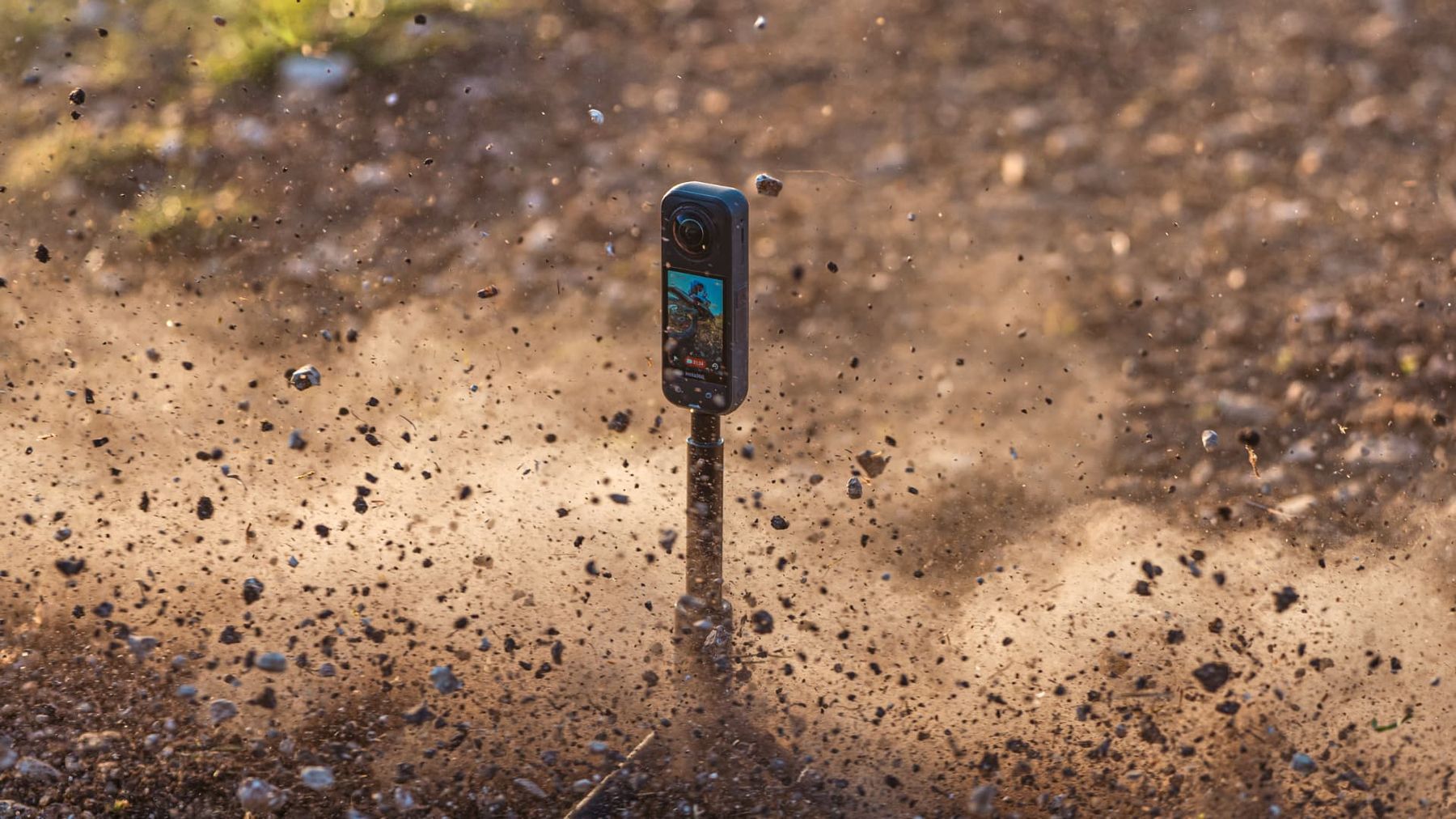 Insta360 X5 filming close to the ground as dirt sprays past